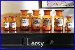 Serie de 7 pots ou flacons en verre marron de pharmacie ou apothicaire