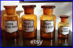 Serie de 7 pots ou flacons en verre marron de pharmacie ou apothicaire