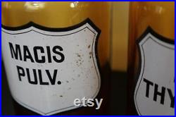 Serie de 7 pots ou flacons en verre marron de pharmacie ou apothicaire